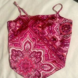 A nice pink magenta and fuchsia top that is tied from that back only wore once